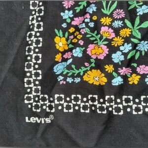 Levi's floral bandana featuring a multi-colored botanical print on black.